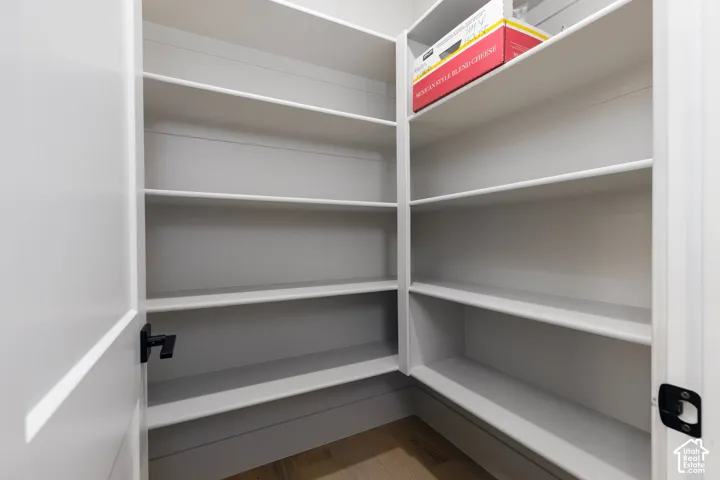 Built-in pantry shelving featuring multiple tiers and a corner configuration
