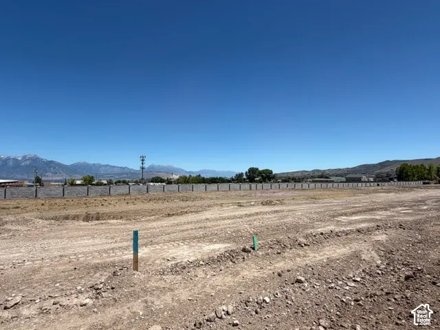 Expansive cleared lot with mountain scenery