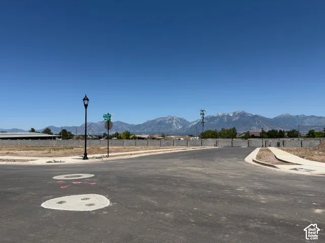 Paved streets and sidewalks, street lamp, mountain backdrop