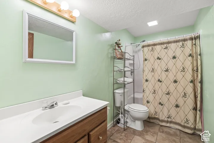 Wood-finish vanity with an integrated sink and chrome faucet