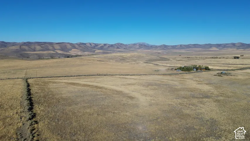 Expansive dryland acreage with distant mountain ranges