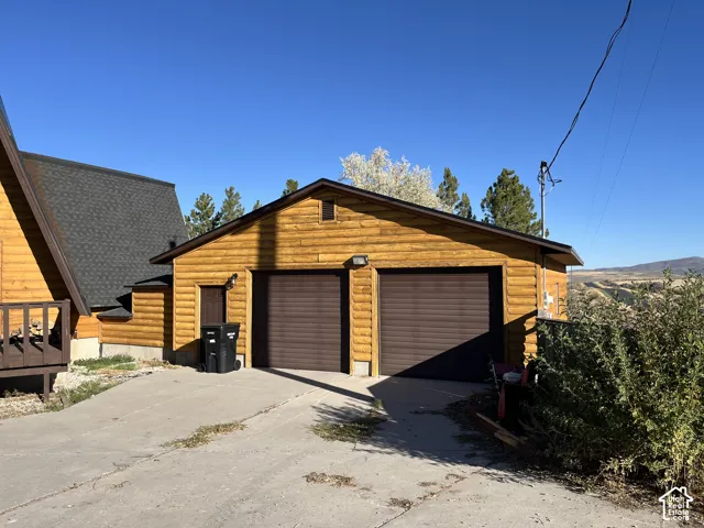 Log-sided exterior with a two-car garage