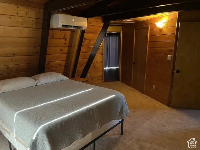 Wood-paneled walls and ceiling with exposed structural beams