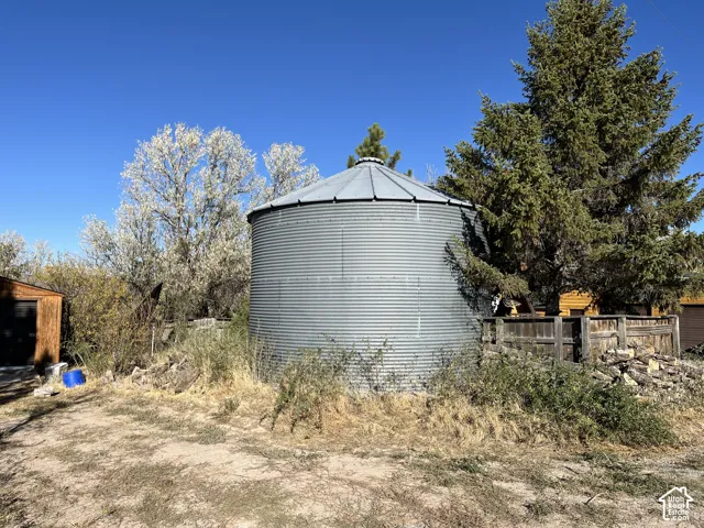 Corrugated metal silo structure with a conical roof