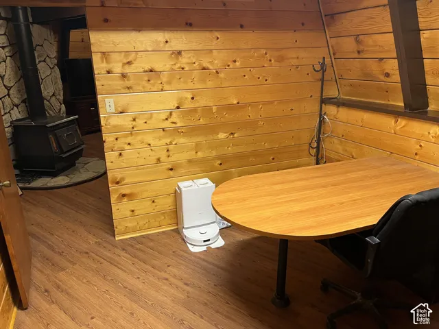 Wood-finish flooring throughout, complemented by wood plank wall paneling