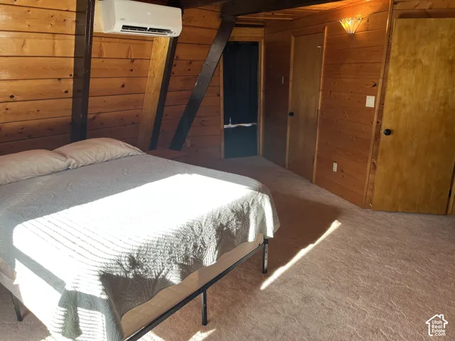 Wood-paneled walls and ceiling with exposed structural beams