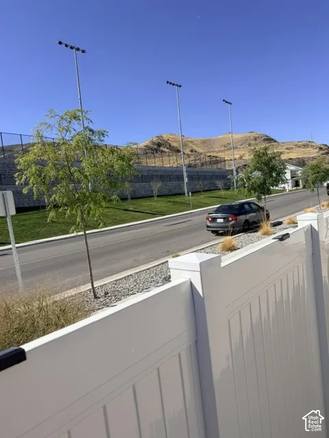 White privacy fencing borders the property