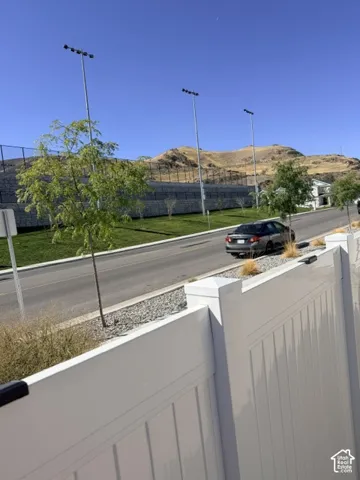 White privacy fencing borders the property