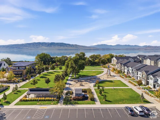 Expansive green spaces featuring mature trees and landscaped pathways