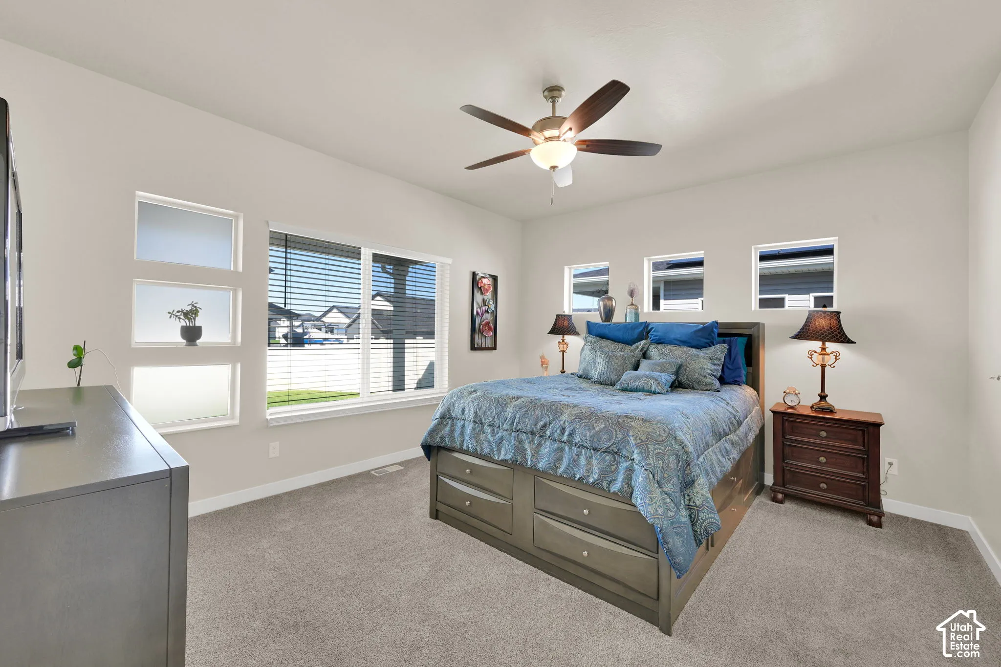 Primary bedroom with lots of windows and natural light and decor windows