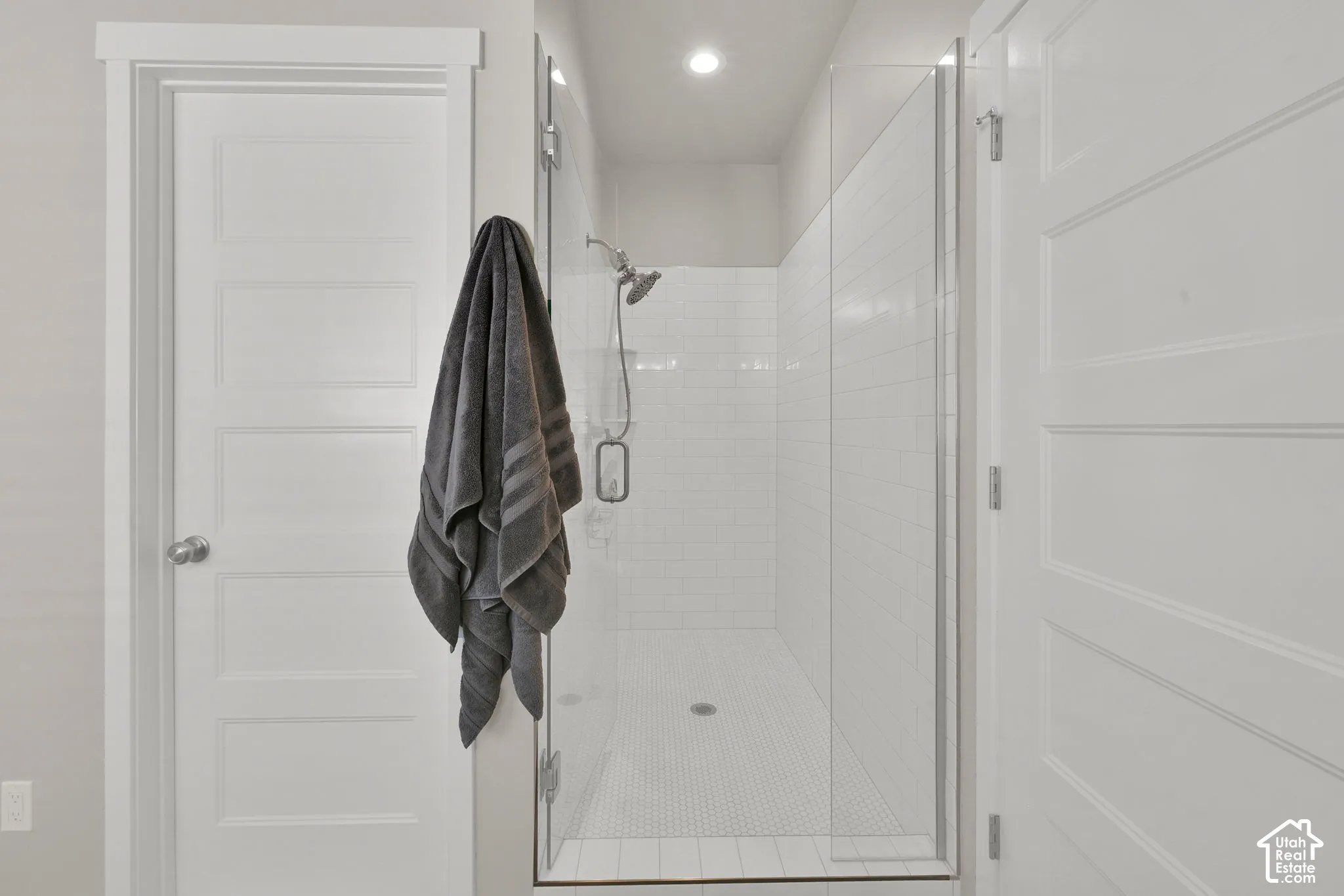 European glass with large walk-in shower and tiled walls