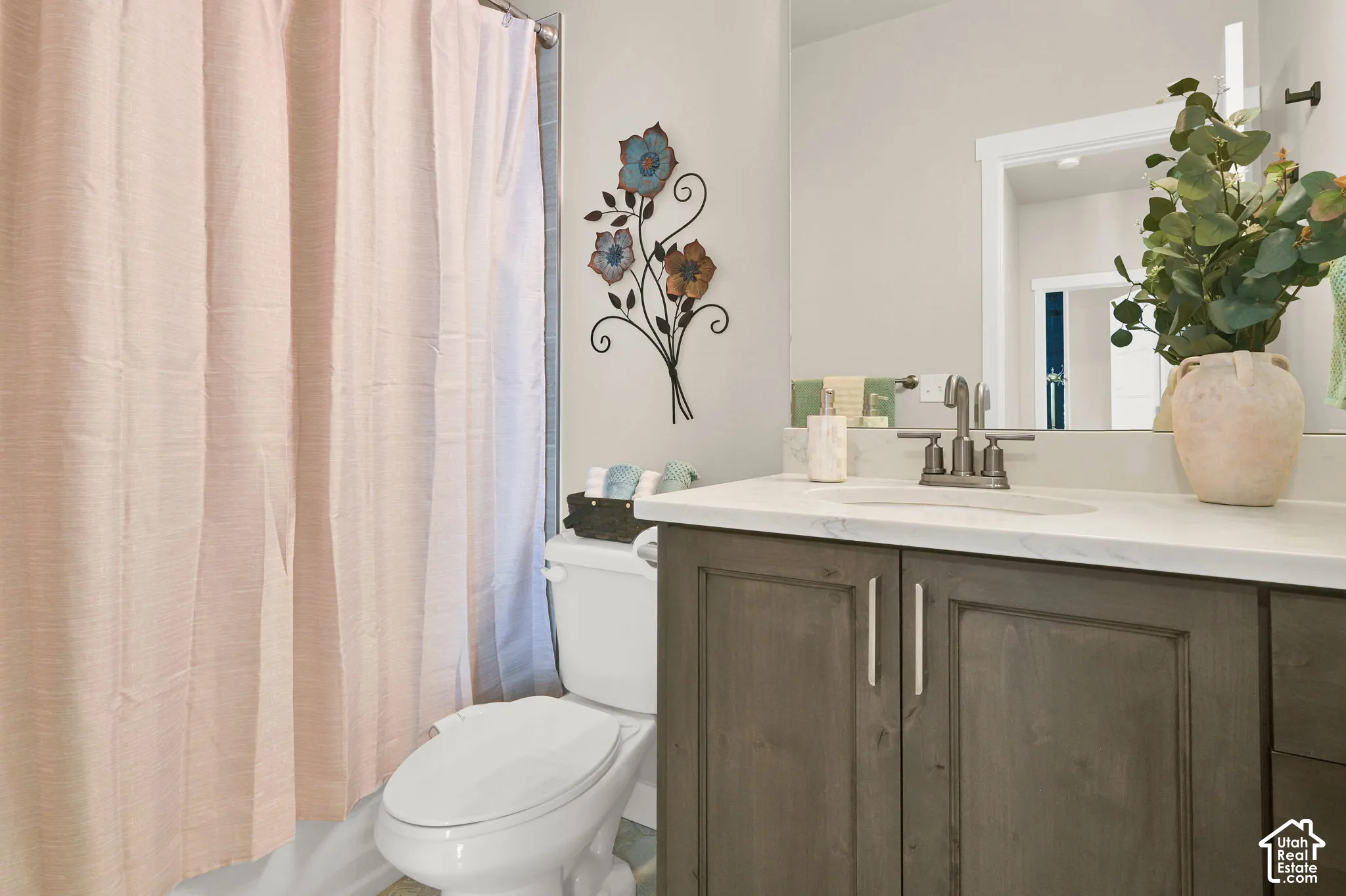 1st bathroom next to the 2 bedrooms that are on the other side of the primary bedroom