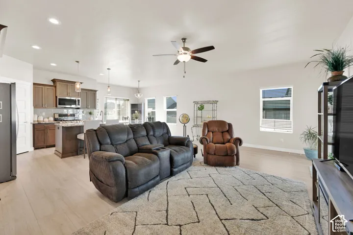 Recessed lighting with ceiling fan and lots of windows