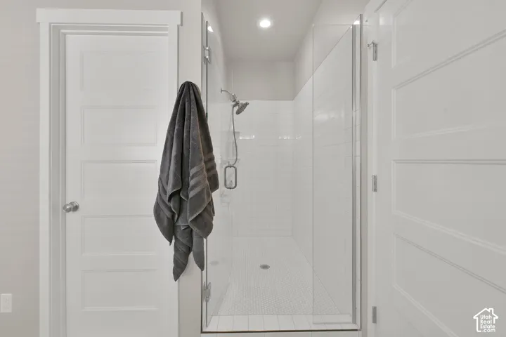 European glass with large walk-in shower and tiled walls