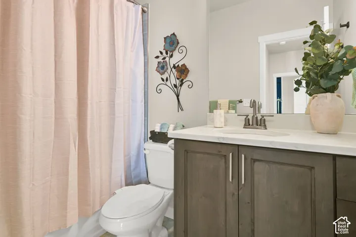 1st bathroom next to the 2 bedrooms that are on the other side of the primary bedroom