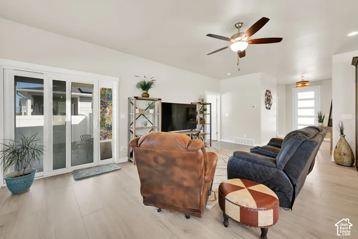 Sliding glass door to the back covered patio, open concept for living and kitchen