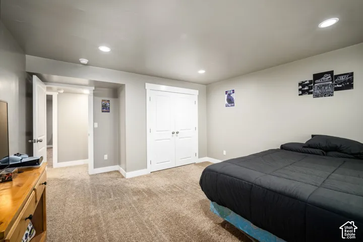 Neutral color palette, recessed lighting, and carpeted flooring