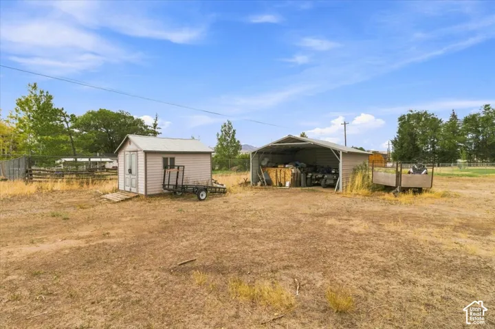 Detached storage shed with a single window and double doors