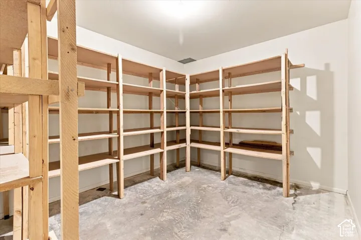 Built-in wood shelving units provide extensive storage capacity