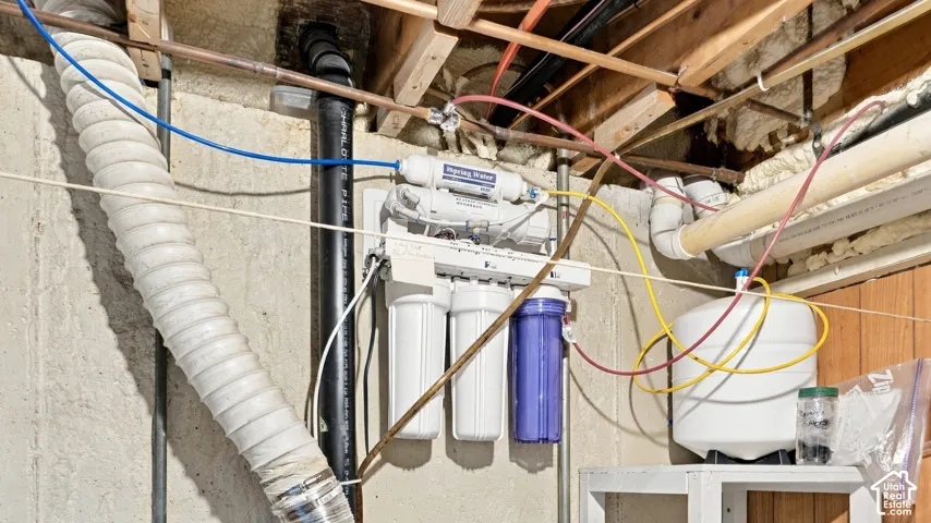 Multi-stage water filtration system featuring a pressurized storage tank and reinforced piping