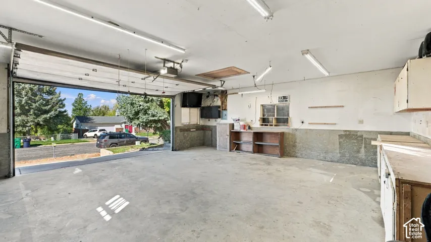 Need a workshop? You've found it! This spacious detached garage features 220V power, built-in storage, workbenches, and room for all your projects and hobbies!
