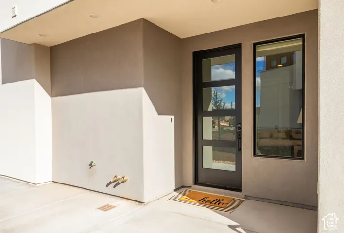 Entryway featuring a contemporary door with four glass panels, a full-length sidelight, and recessed lighting