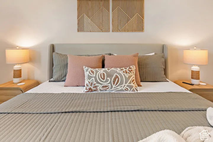 Upholstered headboard with accent wall decor
