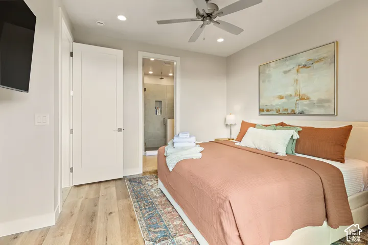 Wood-finish flooring, recessed lighting, and a ceiling fan with light fixture