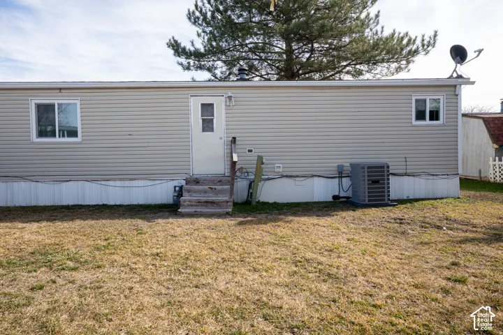 Beige horizontal siding with white trim