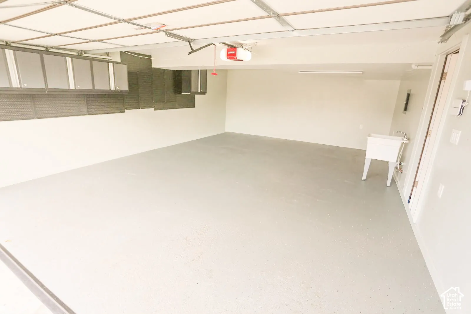 Attached overhead storage cabinetry and pegboard system