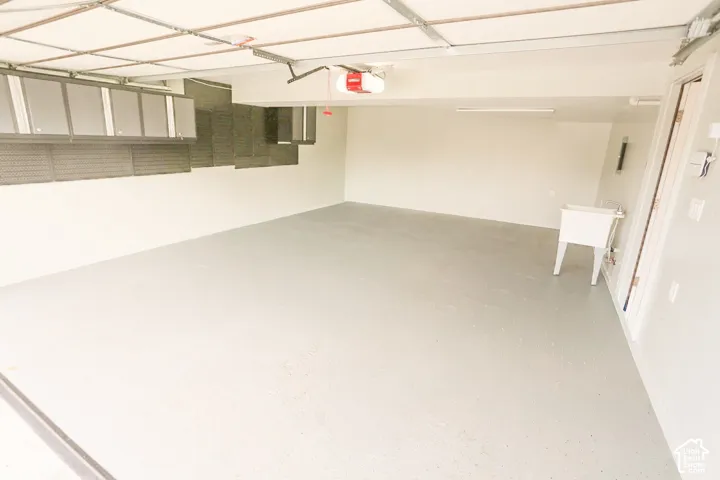 Attached overhead storage cabinetry and pegboard system