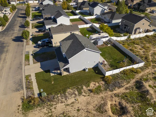 Two-story residence with a gray exterior, dark shingle roof, and an attached two-car garage