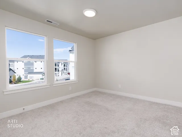 Neutral wall color with two large windows