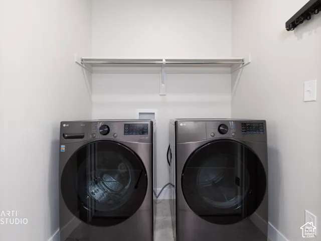 Laundry area featuring a utility shelf