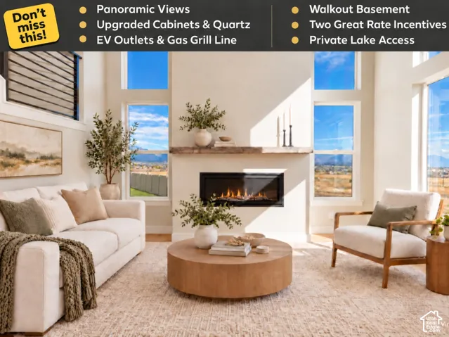 Living area featuring high ceilings, large multi-pane windows, wood-finish flooring, and a linear fireplace with a prominent timber mantel