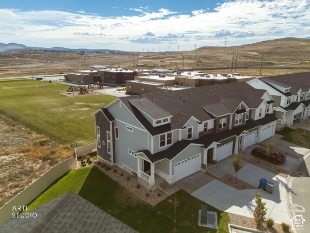 Townhome community featuring multi-level residences with attached garages