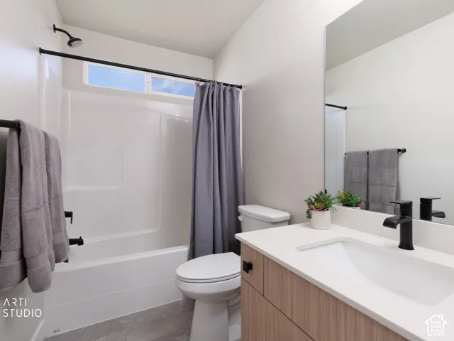 White shower/tub combination with black fixtures, transom window, and grey shower curtain