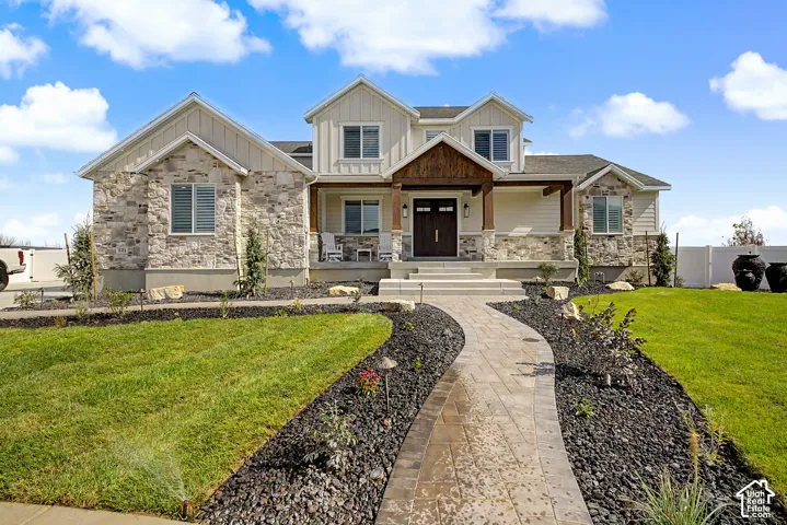 Exterior featuring stone and board-and-batten siding