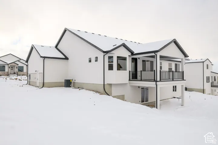 Contemporary-style exterior with white siding and black trim accents