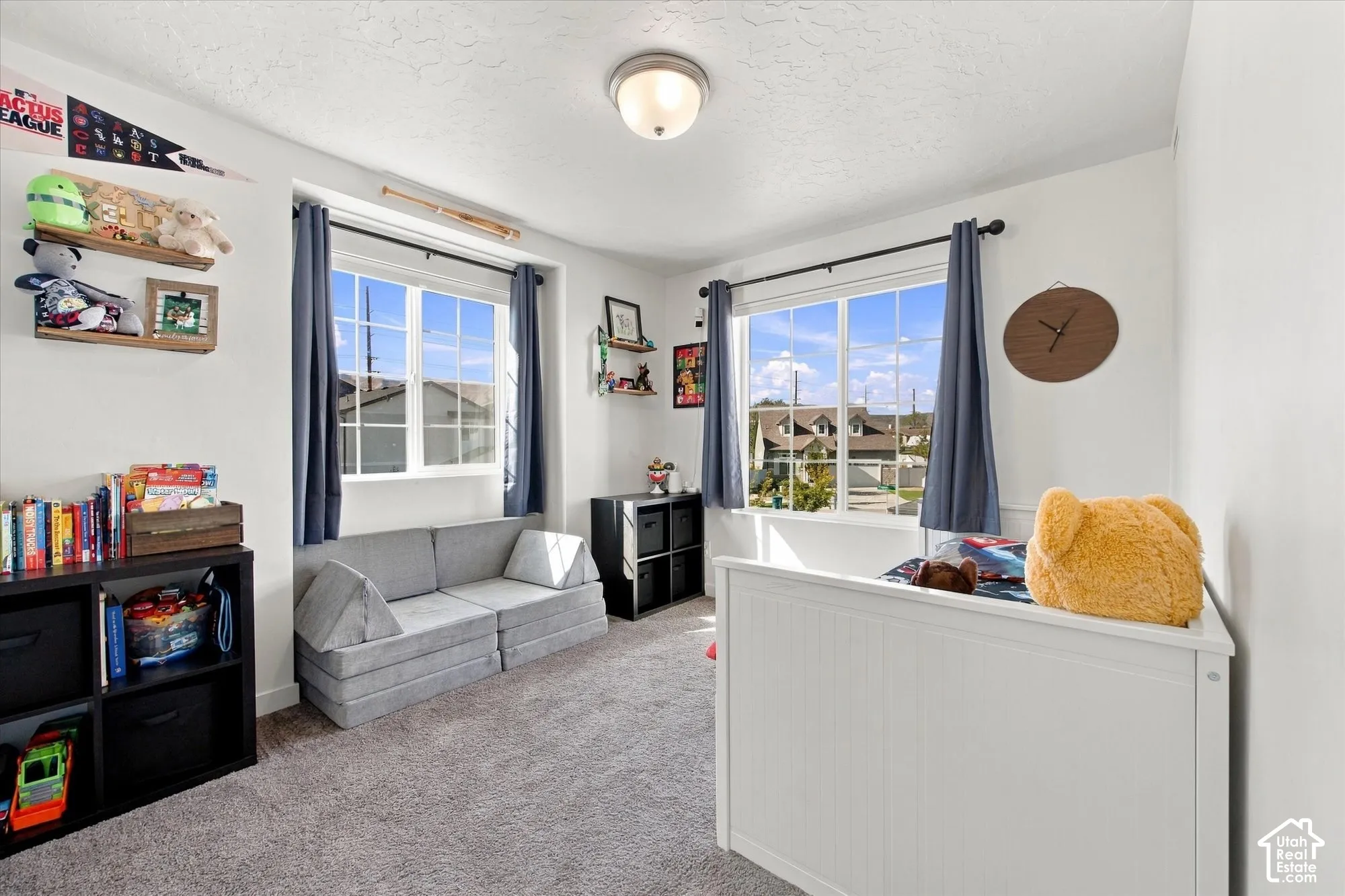 White walls and a neutral carpet provide a versatile palette