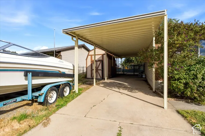 Concrete driveway with an extended carport structure