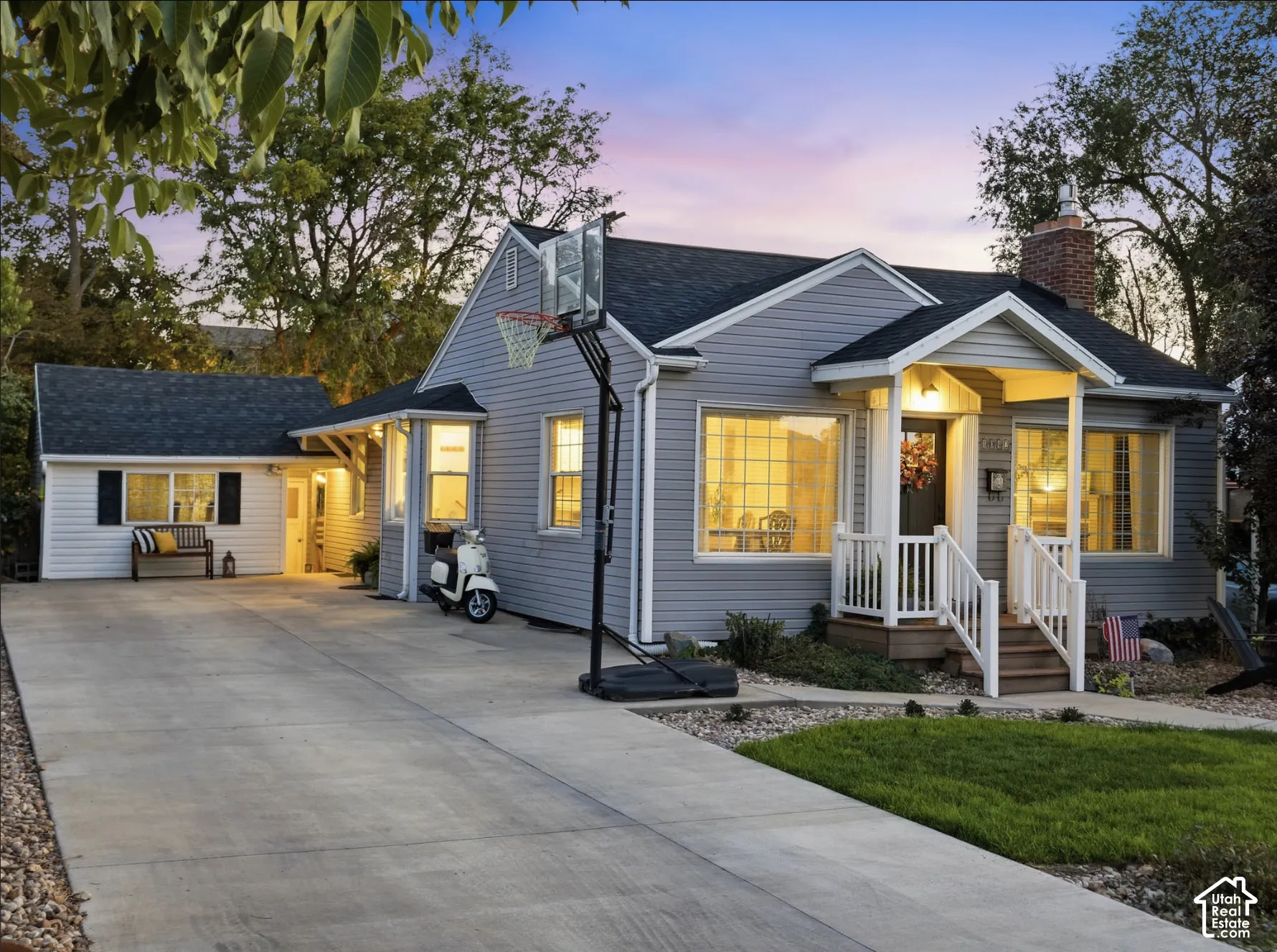 Siding exterior with a covered porch entry featuring white railings