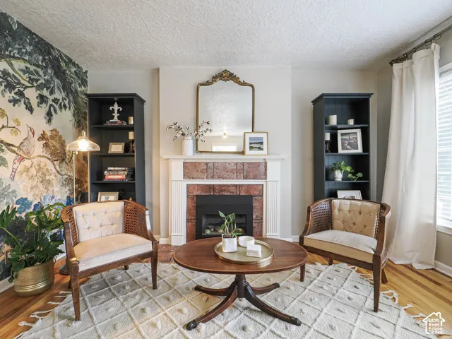 Built-in fireplace with a red brick surround and a white mantel