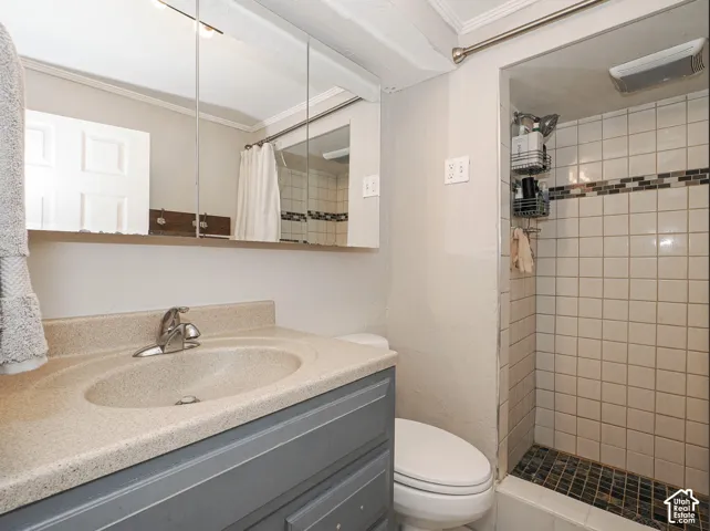 Vanity with integrated sink, chrome faucet, and storage cabinetry