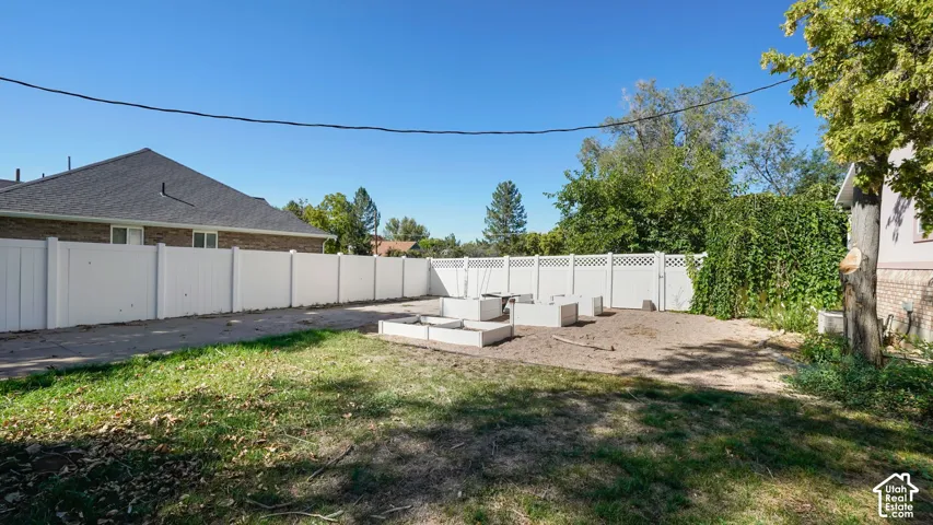 White privacy fencing encompassing the backyard
