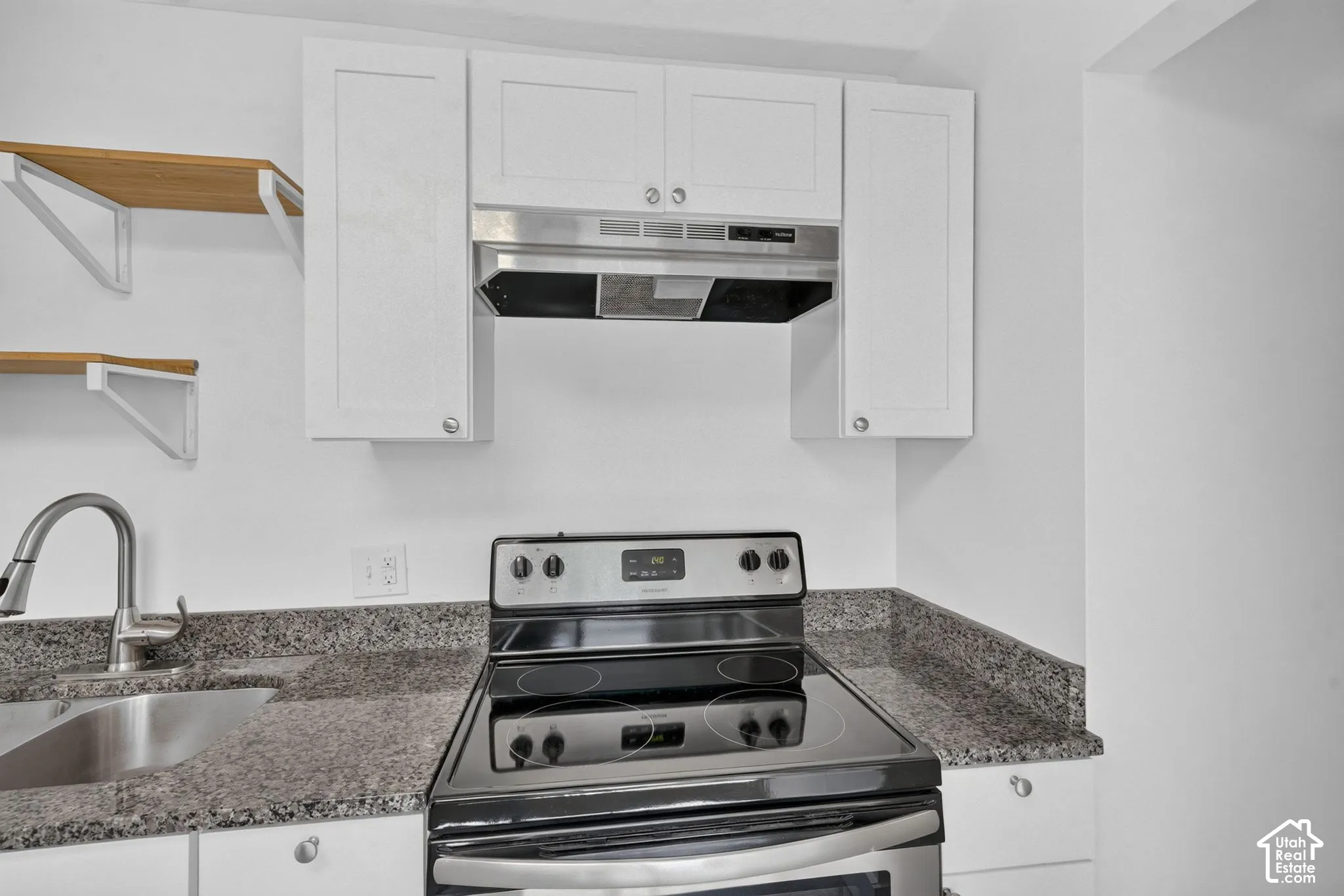 Updated kitchen with granite countertops and fresh paint