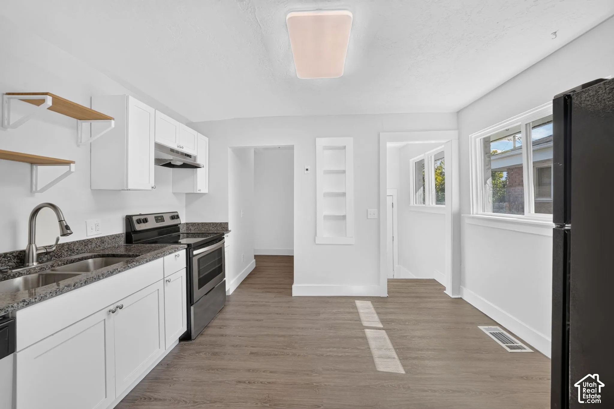 Updated kitchen with granite countertops and fresh paint
