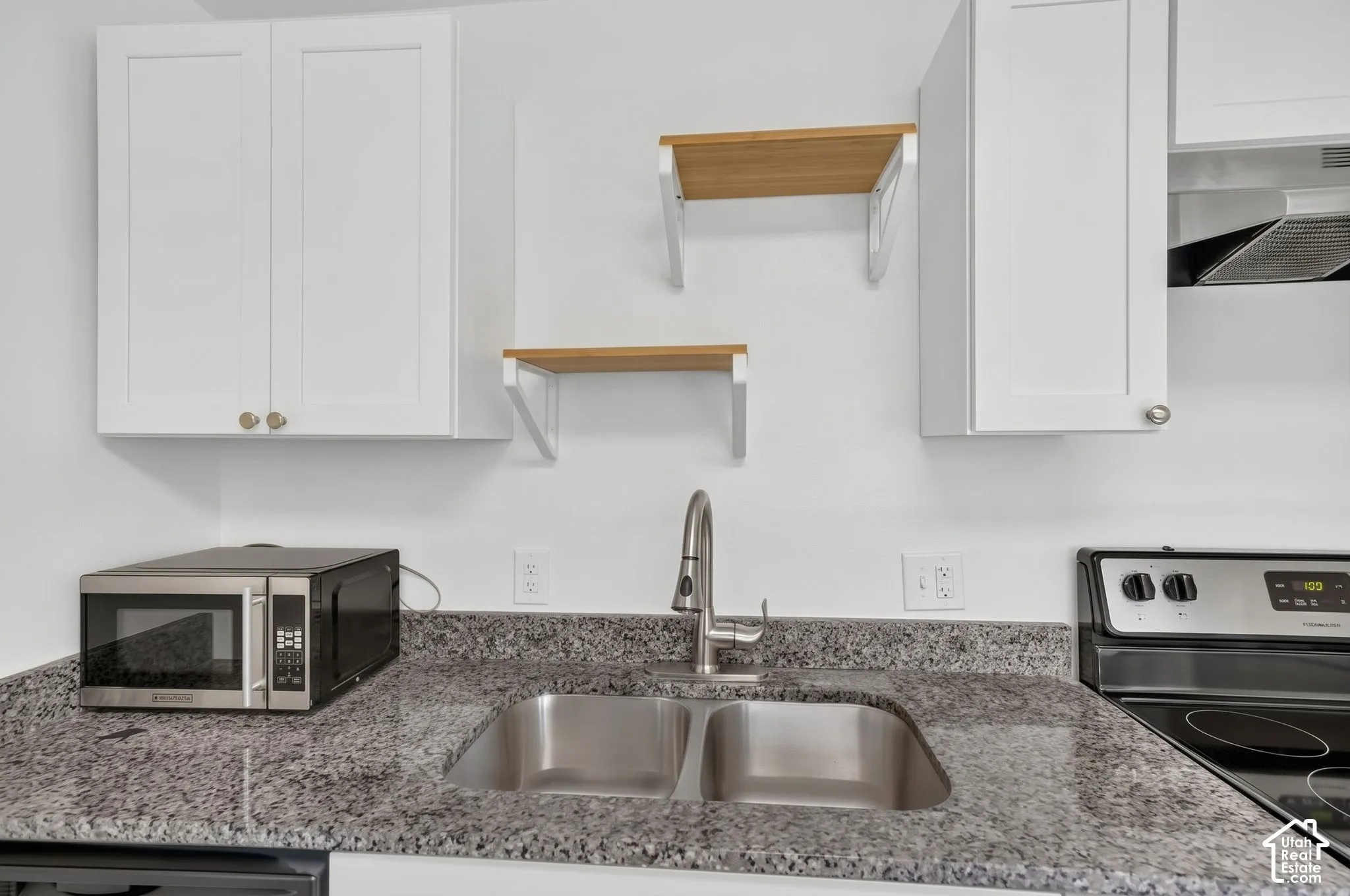 Updated kitchen with granite countertops and fresh paint