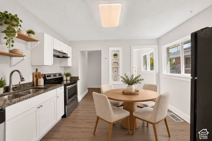(Virtually Staged) Updated kitchen with granite countertops and fresh paint