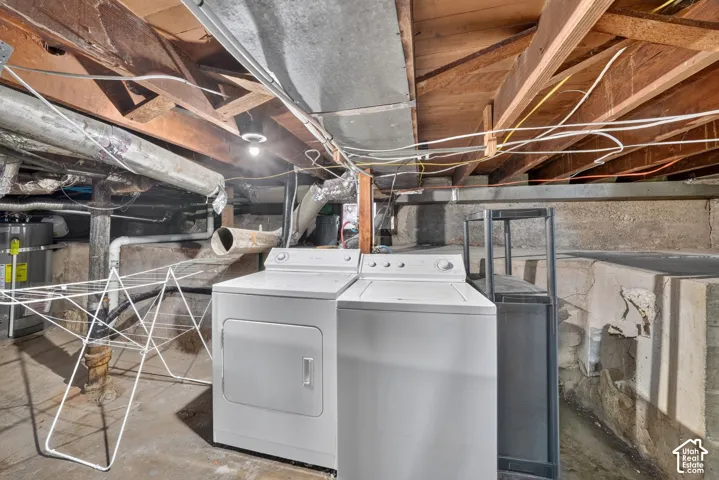 Basement area featuring washer and dryer and storage